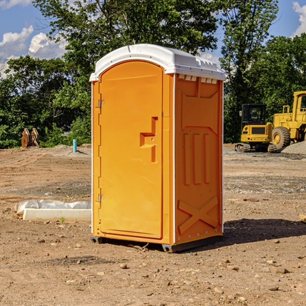 what is the cost difference between standard and deluxe portable restroom rentals in Bellmont